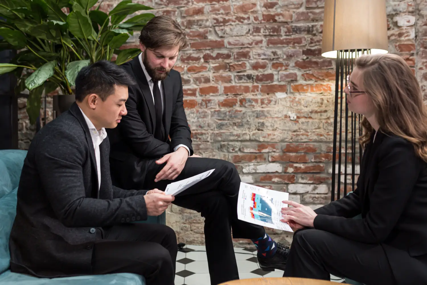 business meeting and sales process with potential buyers around conference table