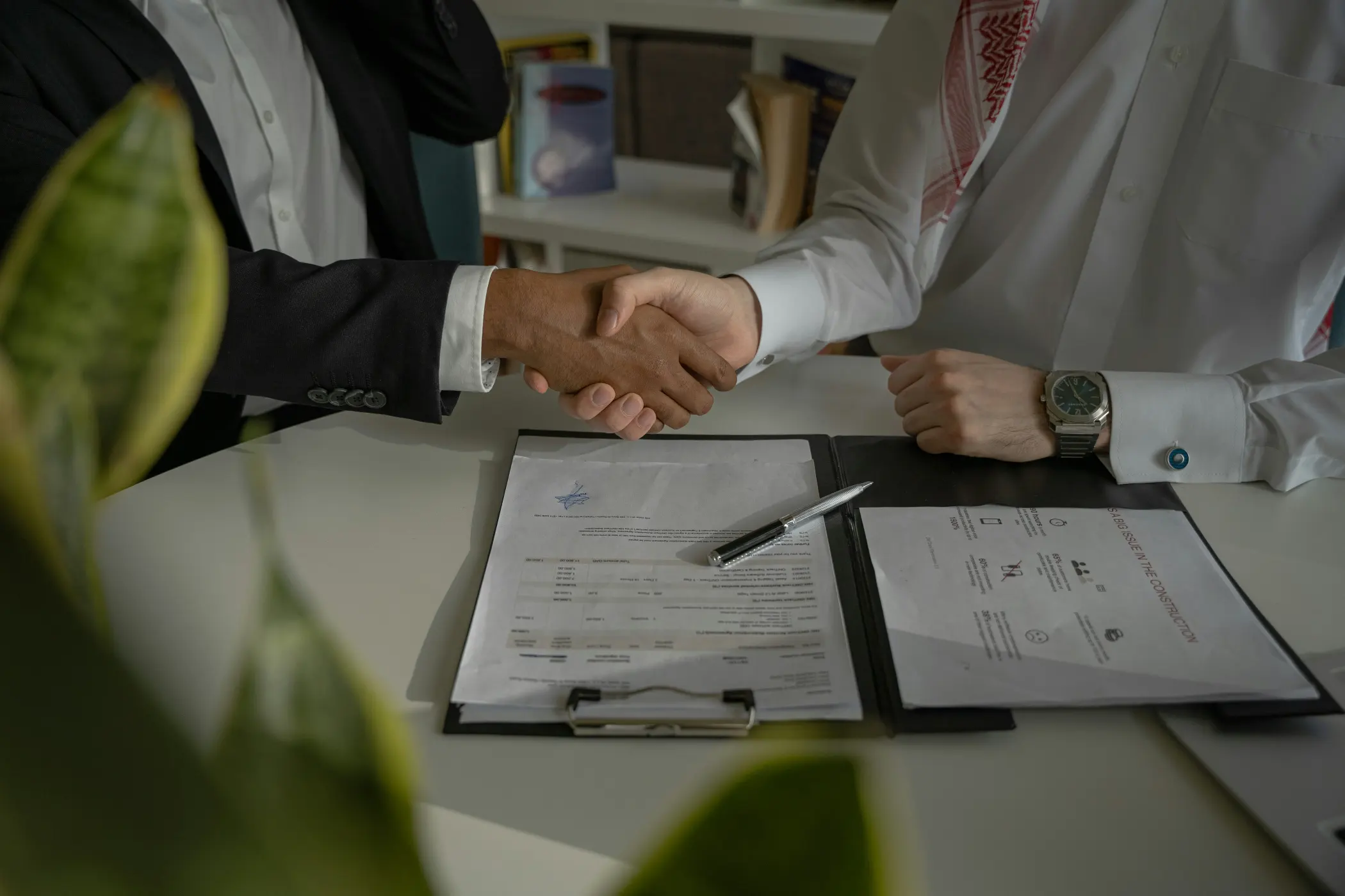 two business owners shake hands over negotiated deal