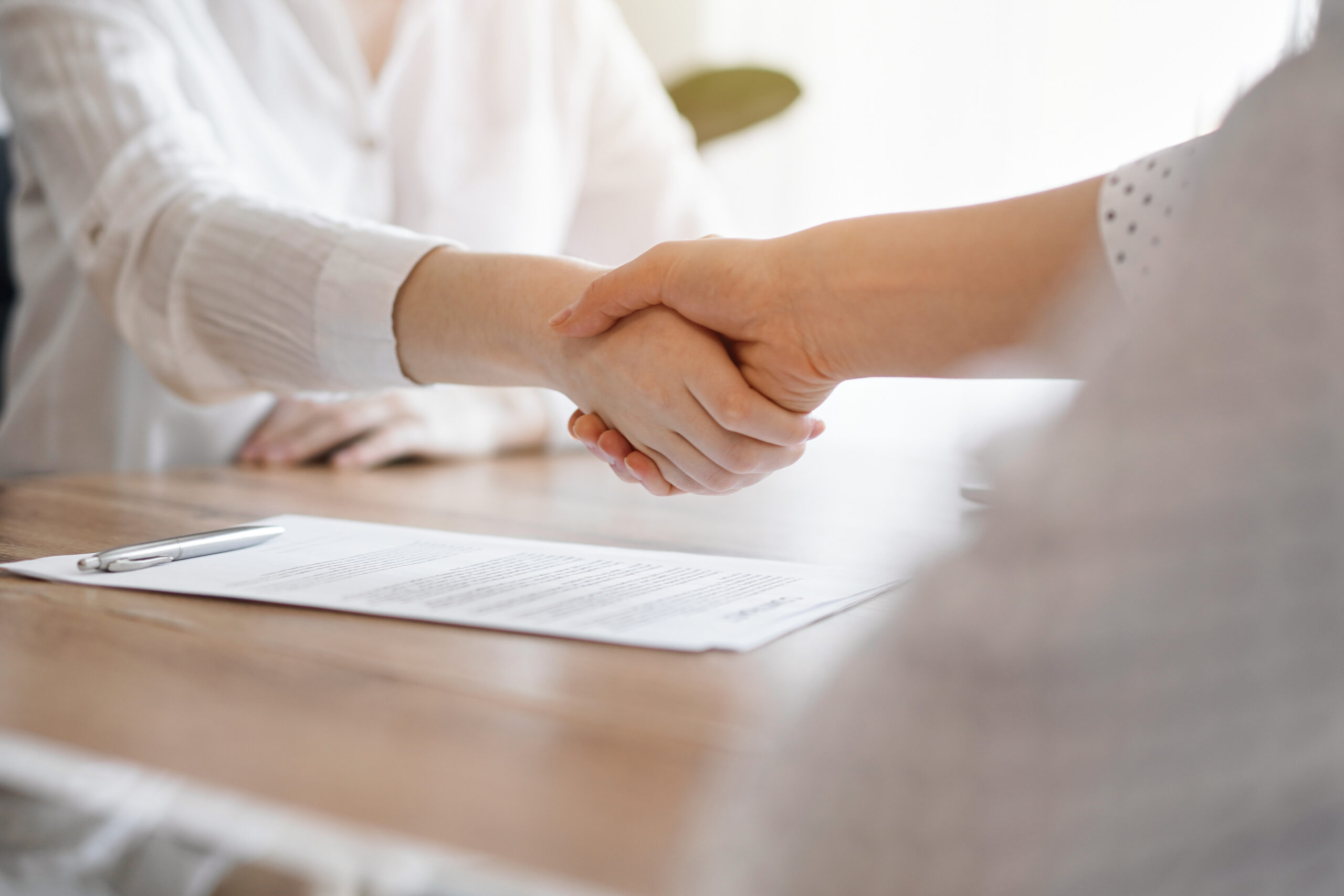 business owners shake on existing business sale in south florida business brokerage deal